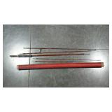 Older shipping tube with fishing rod parts.