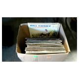 Box with 33 RPM records. Elvis, Tina Turner, Bill