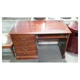 Knee hole desk with four drawers, one is missing