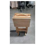 Four TV trays with stand