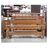 Full size wooden bed with metal rails