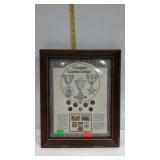 Framed collection of emergency war time coinage.