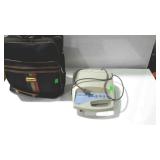 ResMed CPAP machine with carry bag.