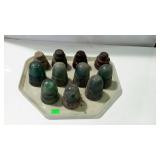 Tray with eleven insulators. Some glass, some