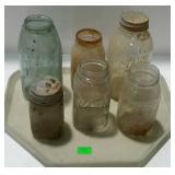 Tray lot of mostly clear, one blue, canning jars.