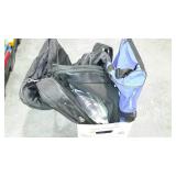 Box of soft-sided luggage and bags.