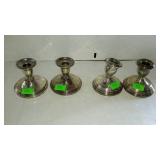 Two sets of sterling weighted candle holders