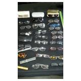 Glasses, glasses, glasses. Some sunglasses and a