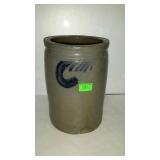 Stoneware crock has a chip 6in opening 9in tall
