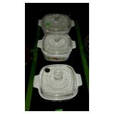 Three covered glass bowls