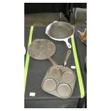 Three cast iron skillets
