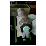 Paper roller with cheetah print paper