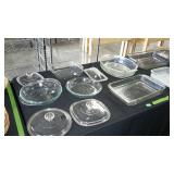 Table lot of bakeware and misc lids