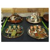 Four decorative plates two with dome lids