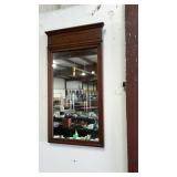 Wall hanging mirror measures 18 inches wide, and