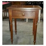 Early bedside table with single drawer and turned