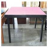 Wooden folding card table with red felt top,