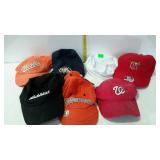 Group of 7 baseball caps, mostly sports related