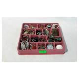 Group of costume jewelry in felt divider