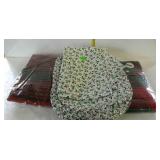 Christmas table linens, eight holly placemats, a