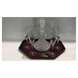 Six champagne glasses and a decanter