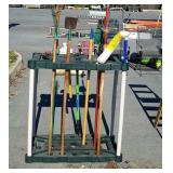 Garden shed tool holder with some tools