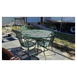Wrought iron patio table and four chairs