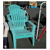 Two plastic blue Adirondack chairs