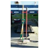 Three long handled tools. Garden rake, soaring