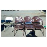 Seven metal folding chairs. 6 are brown, one is