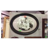 Oval framed picture black and white three kids