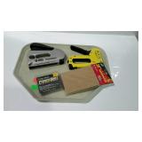 Two staple guns one pk. staples, plus pack of sand