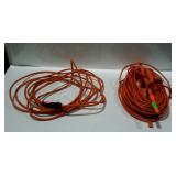 Two electric extension cords, one 50ft one about