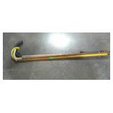 Group of canes, one wooden carved, one wooden