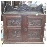 English oak cabinet, with heavy wooden carvings