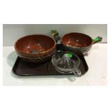 Two handled pottery bowls and a glass juicer