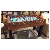 Foosball table, Harvard having 2 game balls,