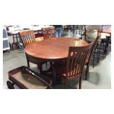 Dining table with four chairs and leaf some minor