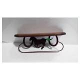 Wall shelf with metal horse and horse shoes
