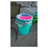 Stack of 5 muck buckets, and one pink poly
