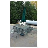 Wrought Iron patio table with four chairs and