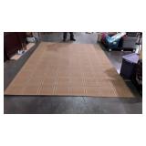 Tan room rug, measures 130 inches long, by 95