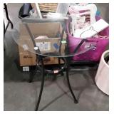Round glass top table, with metal base, measures