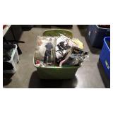 Green tote full of Halloween costumes