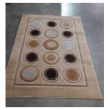 Small tan home decor, designer rug with circles,
