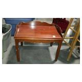 Coffee table with galley railing, shows use wear -