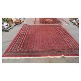 Wool area rug in red tones. Good, clean rug. N
