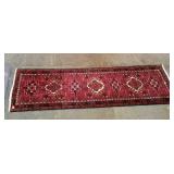 100%wool pile runner rug. Vibrant red color.