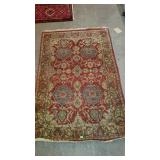 Smaller area rug. Muted colors and has wear