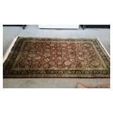 Area rug in dark colors. Burgundy and navy.